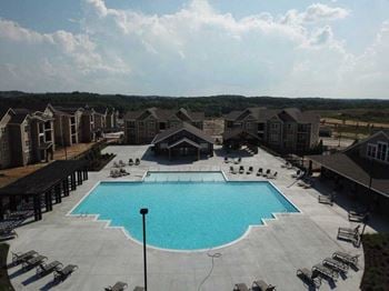 A large swimming pool in front of a building